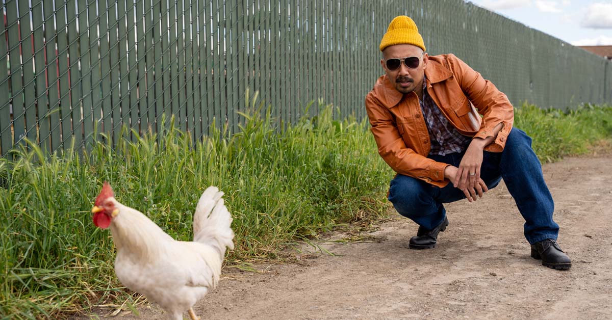 [image: Vietgone actor Jomar Tagatac with a random chicken during a photo shoot]