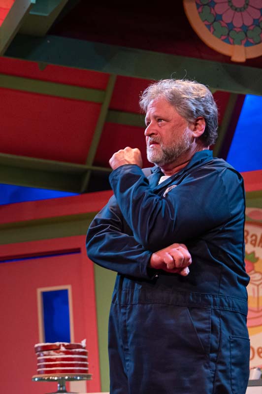 [image: A middle-aged white man with a beard looks sadly into the distance, tears just visible in his eyes]